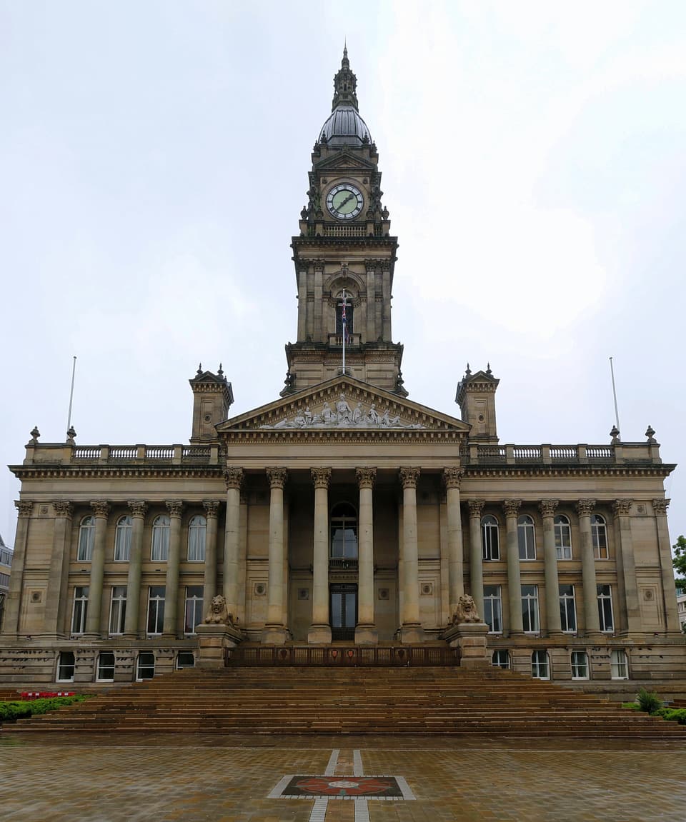 Bolton Town Hall seen from Victoria Square: the clock tower, columned entrance and wide steps